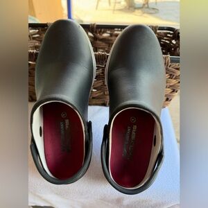 Skechers Black Slip-On croc-like clogs.